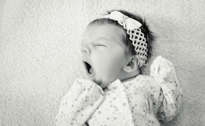 Baby on blanket yawning